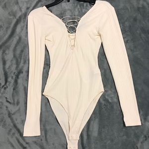 NWT cream bodysuit